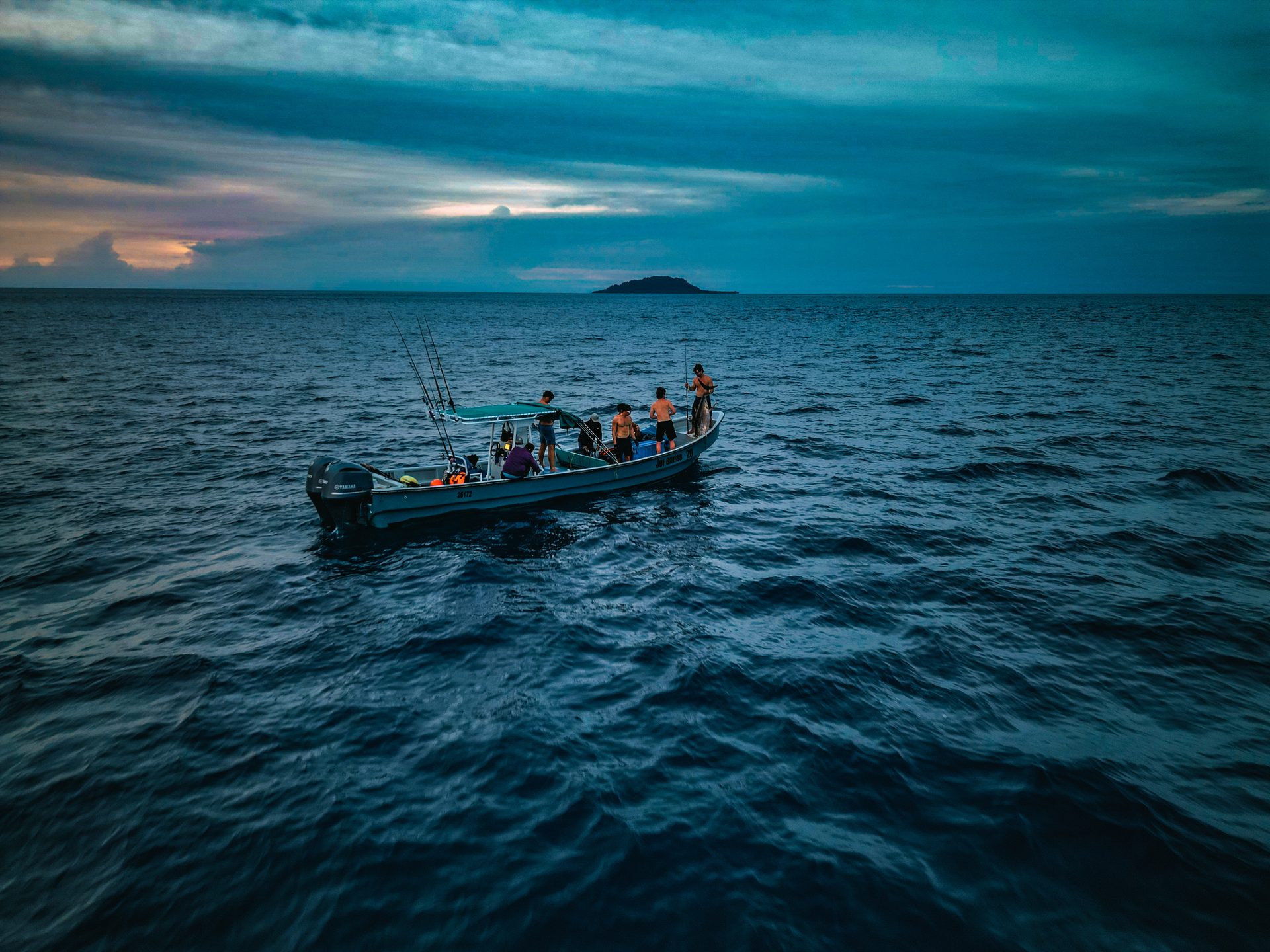 Spearbaby crew on the fishing boat at dusk in Pacific Panama