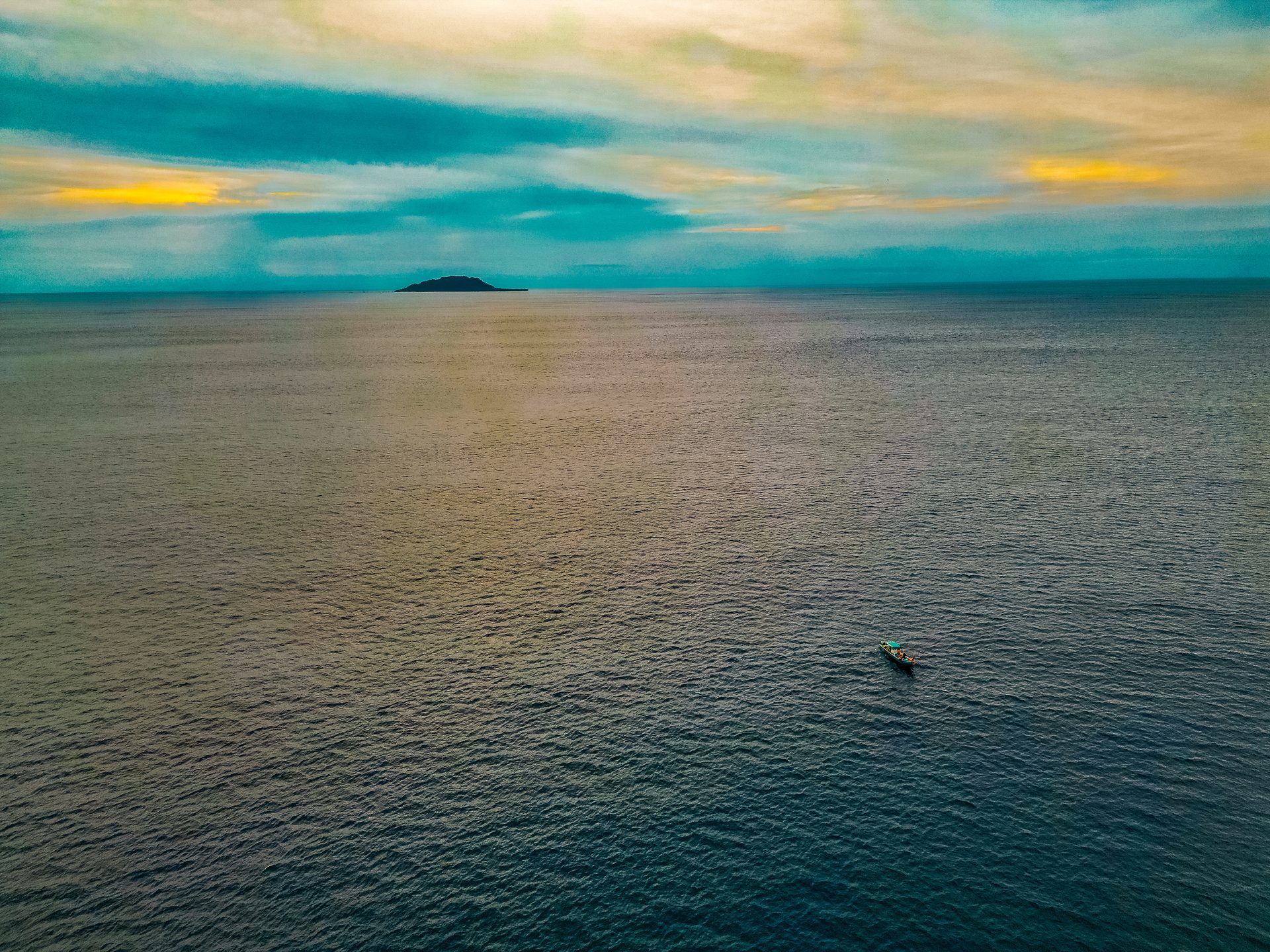 Spearbaby fishing boat alone in the Pacific Ocean at sunset, Panama